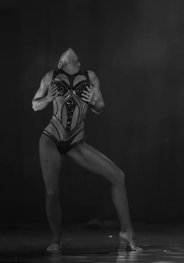Dramatic solo performer in black and white